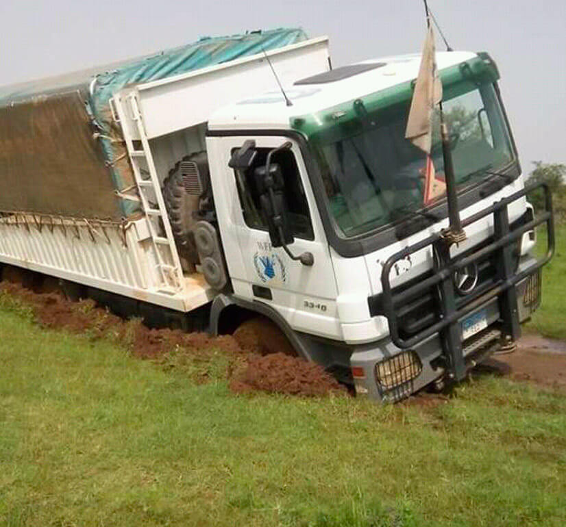 A tilted truck because of mud